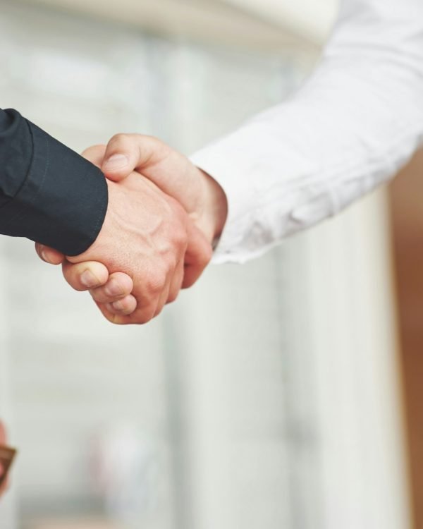 Handshake of two men. Successful business contacts after a good deal